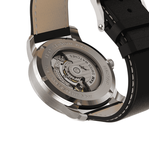 Close-up of stainless steel wristwatch with hand-painted floral dial inspired by tropical plants and black leather strap