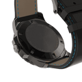 Close-up of RAM Baran Tourbillon R201TS4/1 stainless steel caseback with black and blue stitched leather strap.